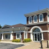 Image of the Bank of Oak Ridge building entrance in Greensboro at Lake Jeanette.