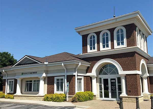 Image of the Bank of Oak Ridge building entrance in Greensboro at Lake Jeanette.