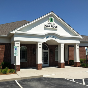 Image of the Bank of Oak Ridge building entrance in Greensboro at New Garden.